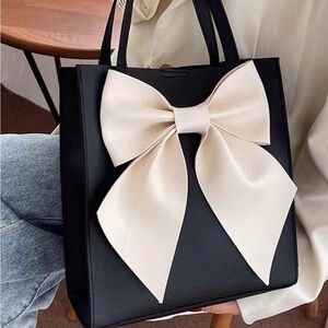 Elegant Black Tote Bag with Cream Bow